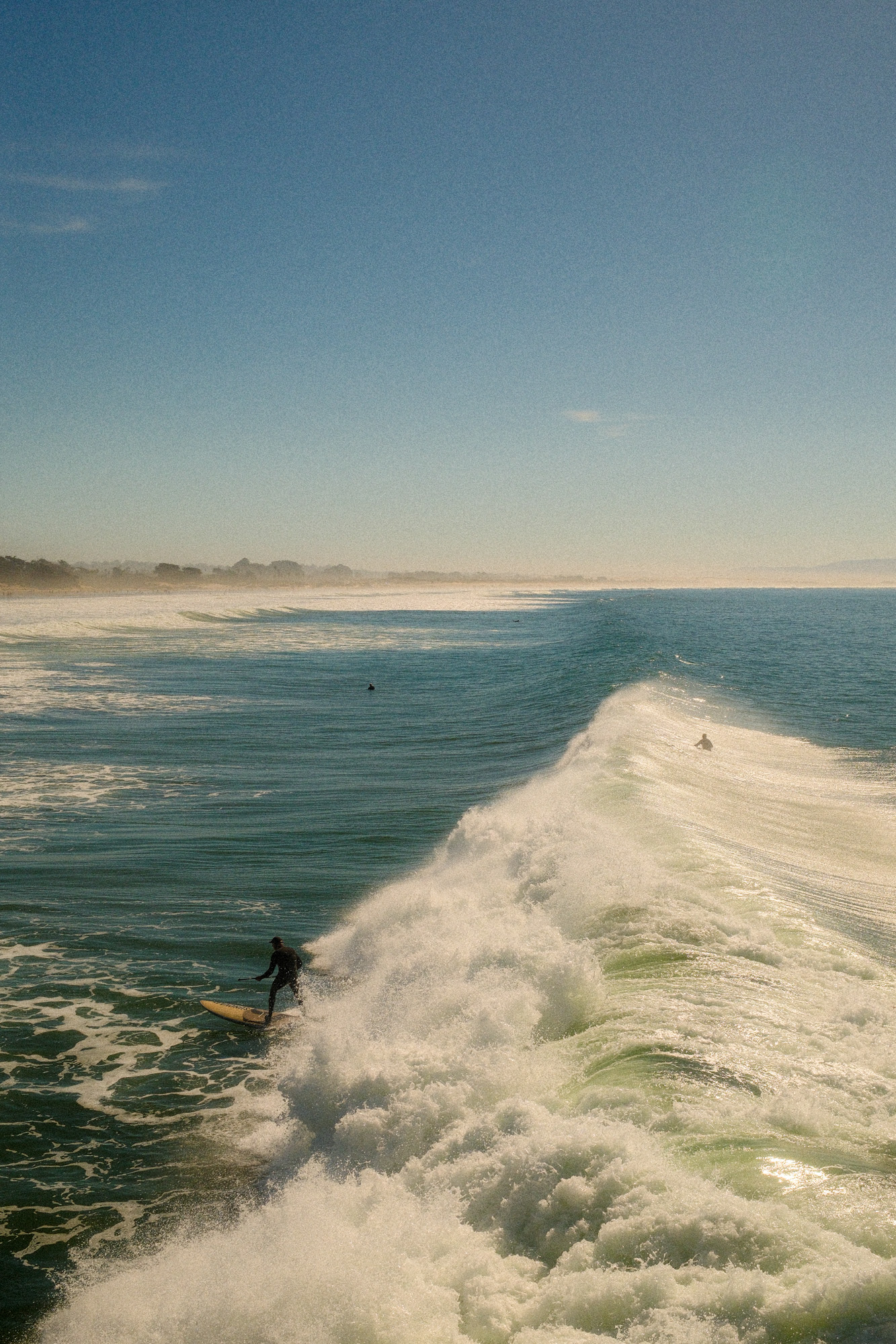 Surfer at Pismo Beach pier