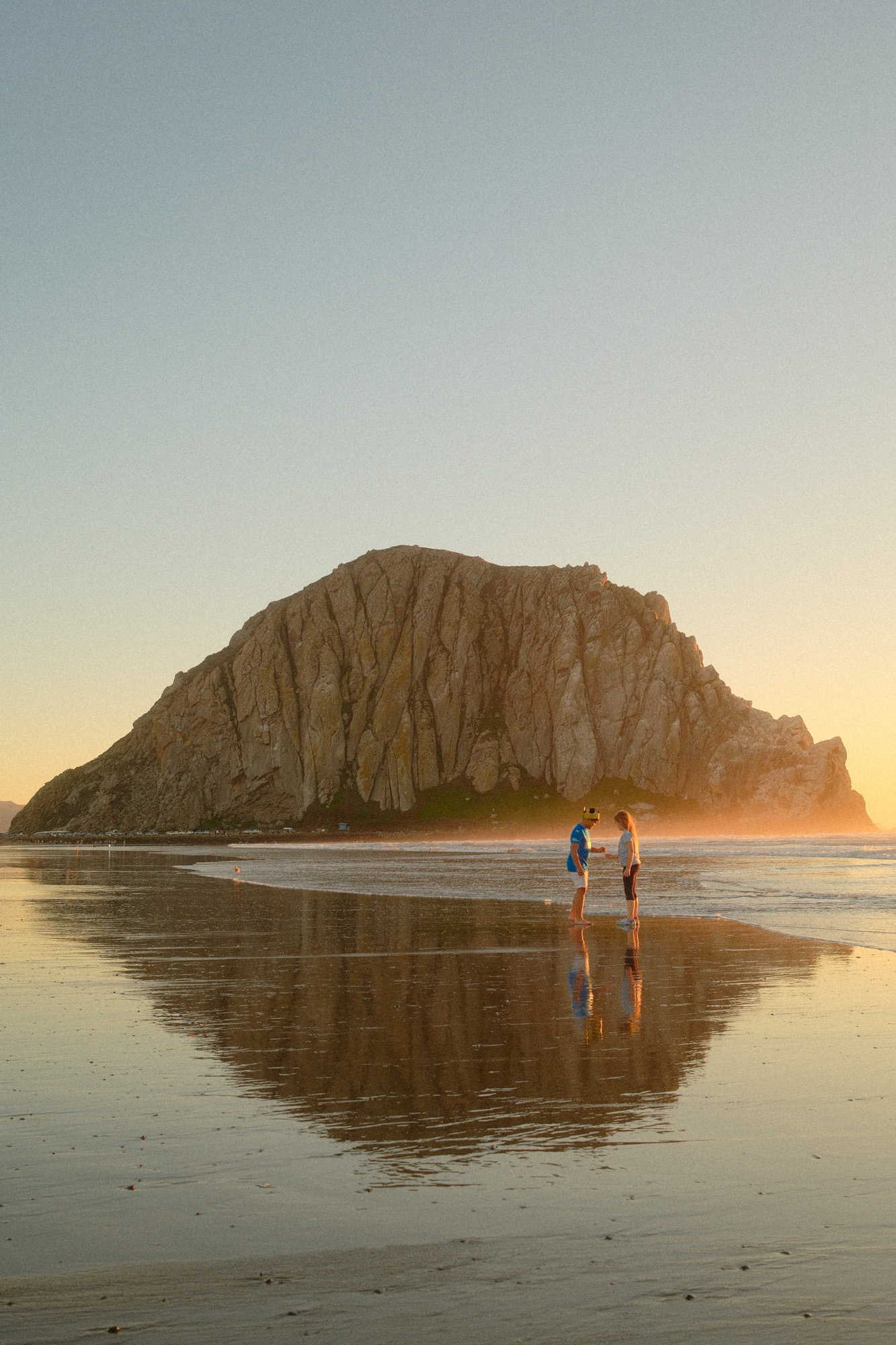 Kids playing rock paper scissors in Morro Bay