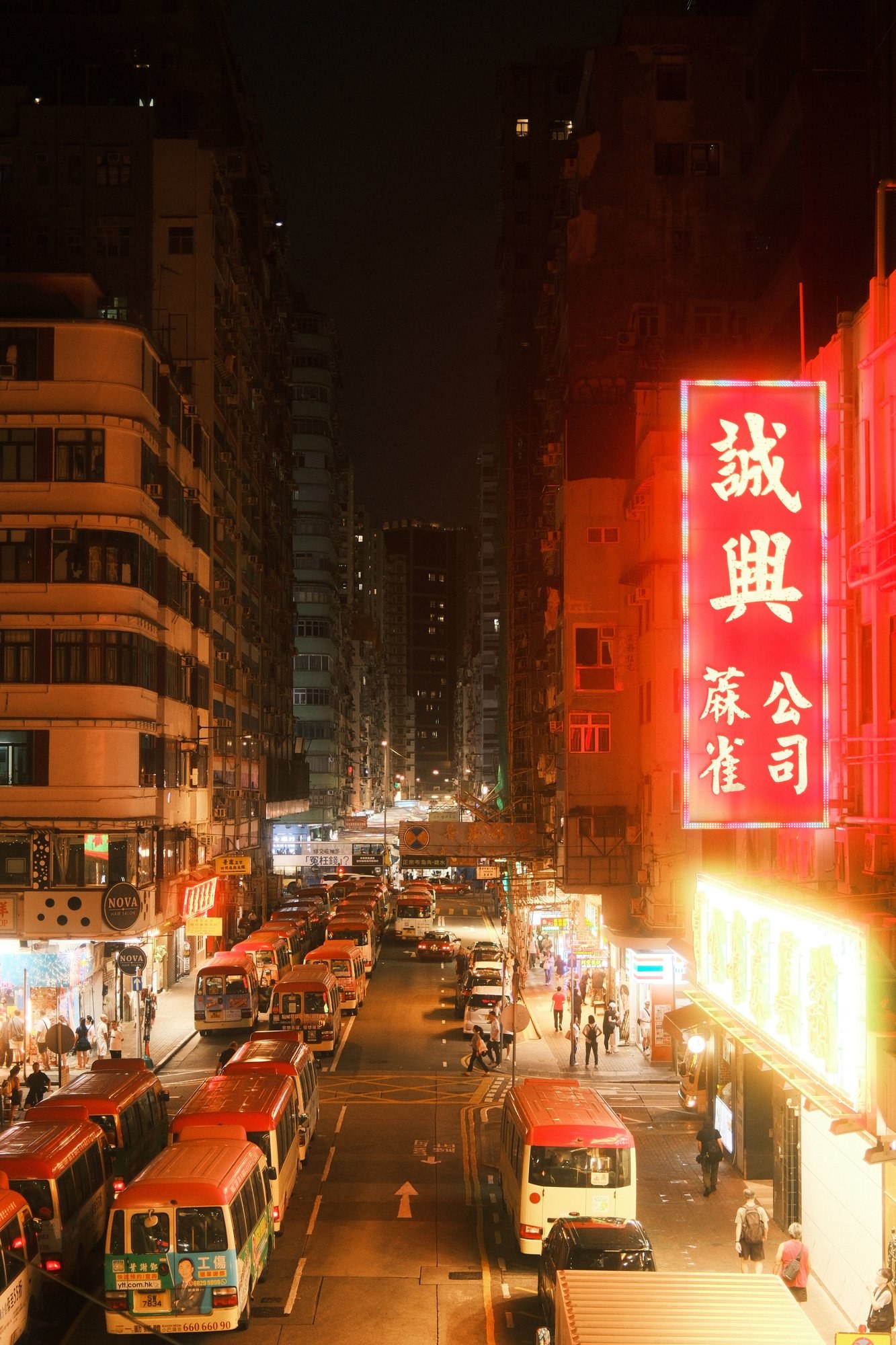 Neon signs over a Hong Kong street at night