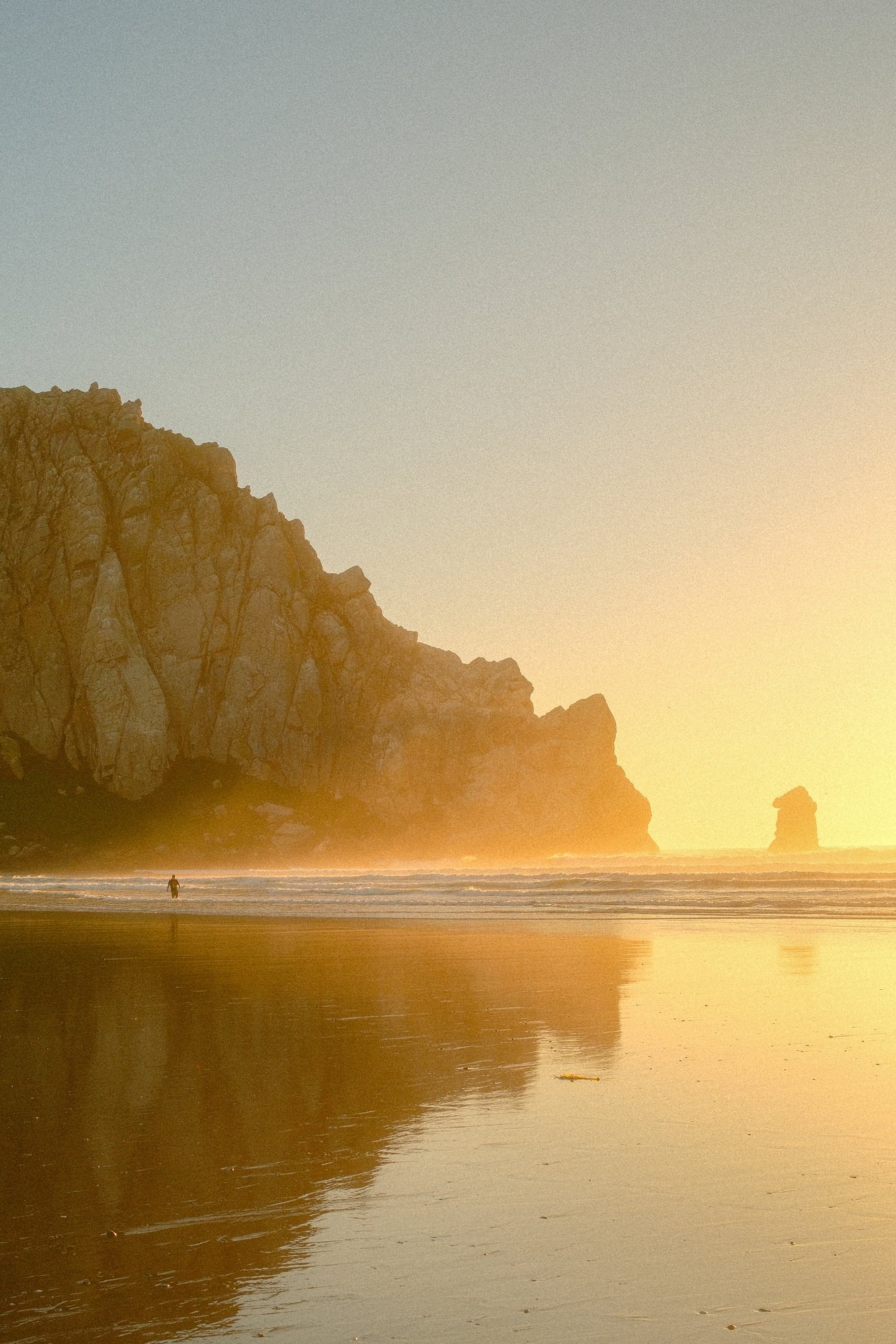 Morro Rock reflected at golden hour