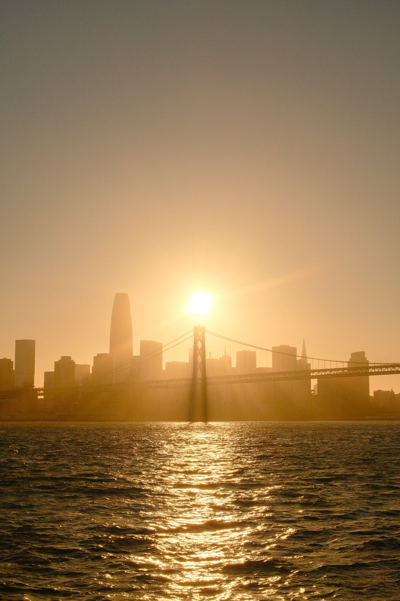 Sun setting behind the San Francisco skyline